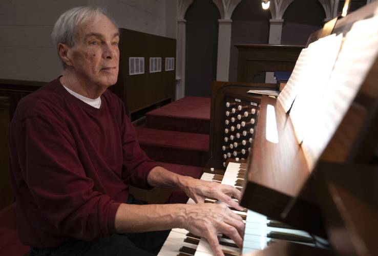 Dick Matteson plays the organ at the First Congregational Church of Amherst where he has been the minister of music for the past 17 years. Matteson is retiring after 65 years as a church musician. 
