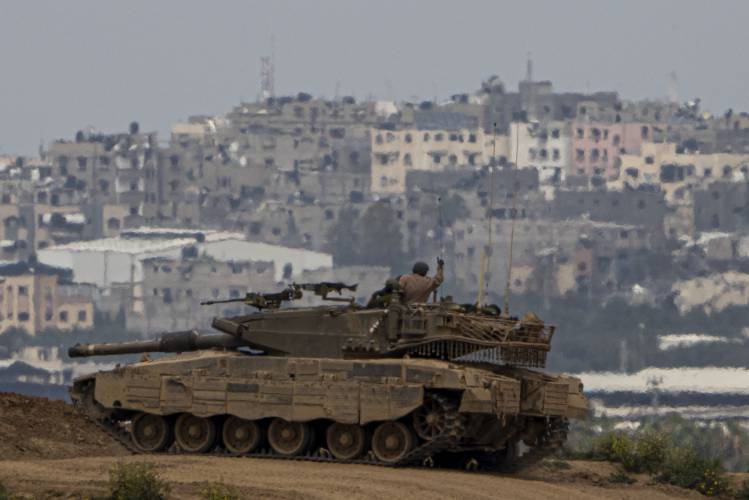 An Israeli soldier on top a tank on the border with the Gaza Strip, in southern Israel, Sunday, Sunday, March 17, 2024. An Israeli soldier on top a tank on the border with the Gaza Strip, in southern Israel, Sunday, Sunday, March 17, 2024.