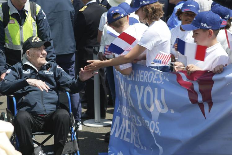 An American D-Day veteran is welcomed at Deauville airport, Monday, June 3, 2024 in Deauville, Normandy to attend D-Day 80th anniversary commemorations.