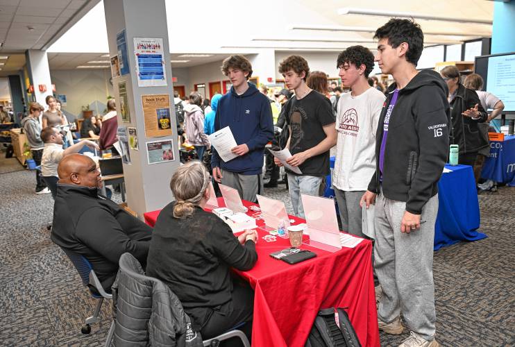 Frontier Regional School students talk with representatives from Coca-Cola Beverages Northeast during the Frontier Career Fair in the Media Center last week.