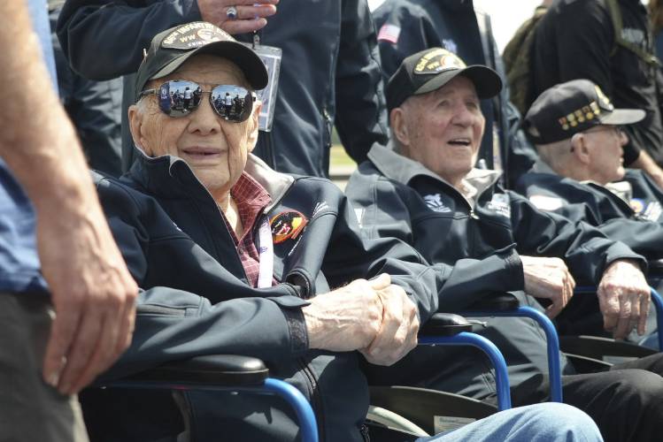 American D-Day veterans sit during a welcoming ceremony at Deauville airport, Monday, June 3, 2024 in Deauville, Normandy to attend D-Day 80th anniversary commemorations.