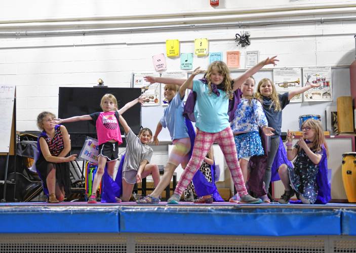 Hawlemont Regional School third graders, with help from some first and second graders, perform “The Weather Friends” musical on Thursday. In the musical, a group of Weather Superheroes respond to weather emergencies around the world and teach people about the water cycle and severe weather.