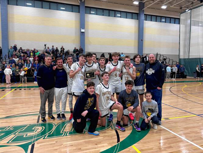 The Pioneer boys basketball team after beating Duggan, 57-39, to win the Western Mass. Class D championship on Saturday at Holyoke Community College. 