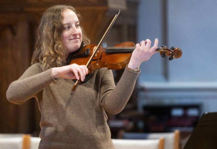 UMass alumna Amanda Stenroos, who is a co-founder of the Bach Festival, in rehearsal for the upcoming festiva