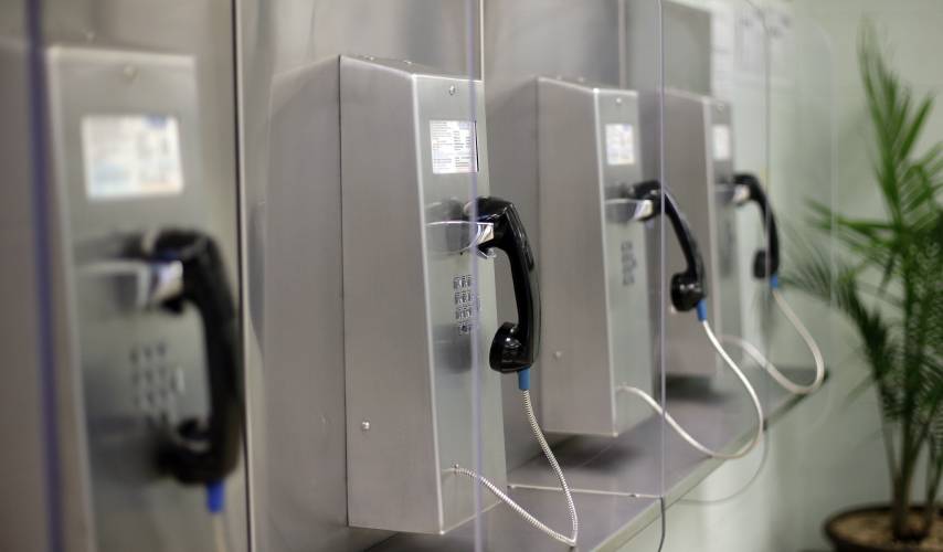 A bank of phones are seen at the Karnes County Residential Center, Thursday, July 31, 2014, in Karnes City, Texas. Federal officials gave a tour of the immigration detention facility that has been retooled to house adults with children who have been apprehended at the border. As a Thursday, Feb. 22, 2024, cell phone outage shows, sometimes landline telephones can come in handy, and were suggested as part of the alternatives when people’s cell phones weren’t working.
