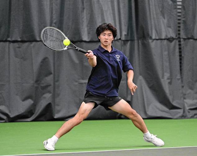 Frontier’s Jacob Han returns a volley against Nantucket in an MIAA Div. 4 Round of 32 match at Deerfield Academy on Thursday. 