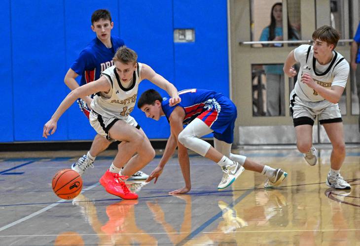 Pioneer’s Judah Glenn creates a turnover against Drury during the Panthers’ 49-23 victory in the MIAA Division 5 semifinals at West Springfield High School Tuesday night.