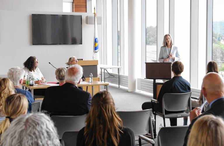 Governor’s Councilor Tara Jacobs and Probate and Family Court judgeship nominee Alexa Flanders listen as Judge Kathleen Sandman, first justice of the Probate and Family Court, speaks about Flanders in a public hearing in the jury pool room at the Franklin County Justice Center on Monday.