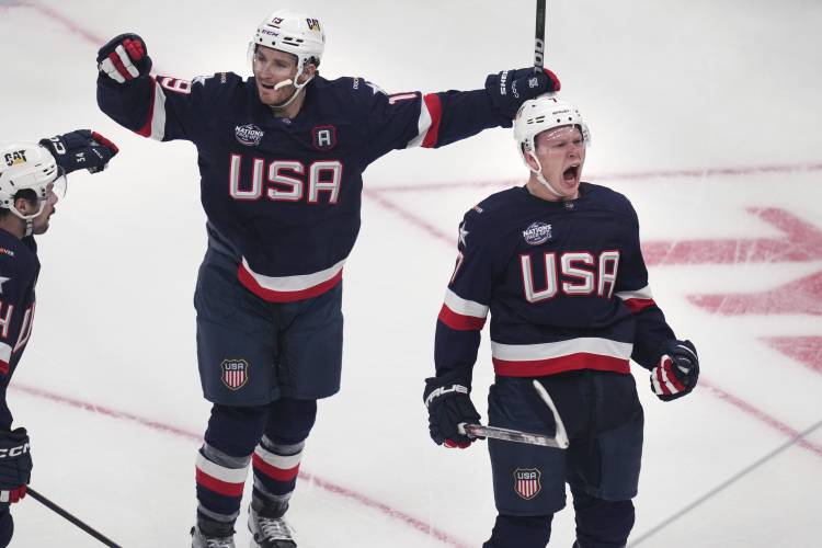 United States' Brady Tkachuk, right, celebrates after his goal against Canada during the first period of the 4 Nations Face-Off championship hockey game, Thursday, Feb. 20, 2025, in Boston. (AP Photo/Charles Krupa)