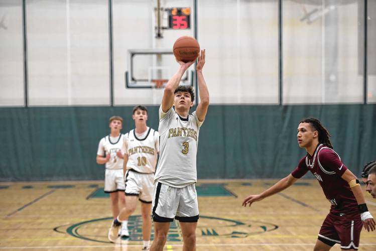 Pioneer's Kurt Redeker shoots a free throw after scoring his 1,000th career point on Saturday against Duggan during the Western Mass. Class D championship game at Holyoke Community College. 