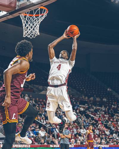  UMass junior Shahid Muhammad (4) dunks the ball during the first half of the UMass men’s basketball team’s 74-51 loss to Loyola Chicago on Saturday, March 8 at the Mullins Center in Amherst, MA.