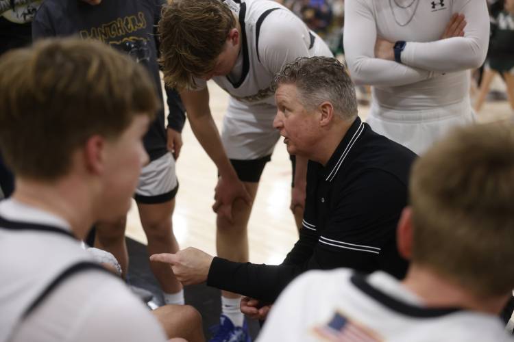Pioneer head coach Scott Thayer talks with his team during the MIAA Division 5 quarterfinal game against Ware in Northfield last week. 