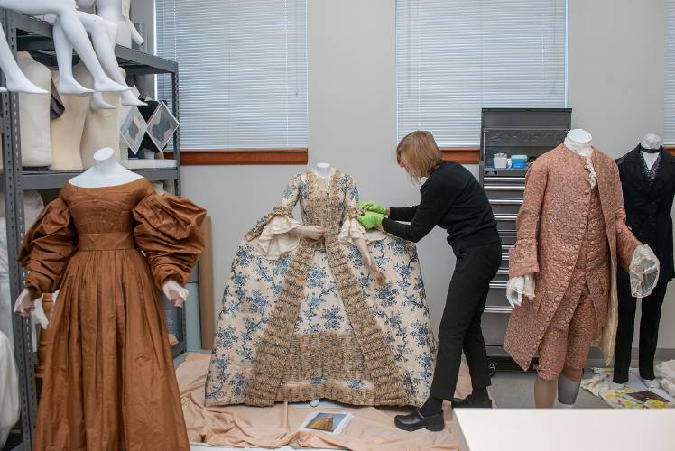 Lauren Whitley, Historic Deerfield’s curator of textiles and clothing, dressing mannequins for “Body by Design” in the textile workroom. The show opens on May 3.
