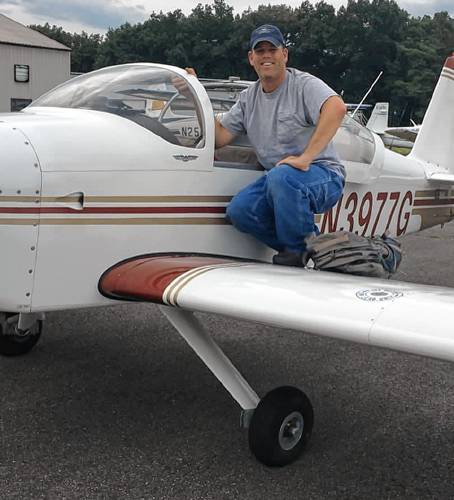 Greenfield resident Michael McIntyre, pictured with a small plane, has been hired to be Franklin County Technical School’s aviation instructor.