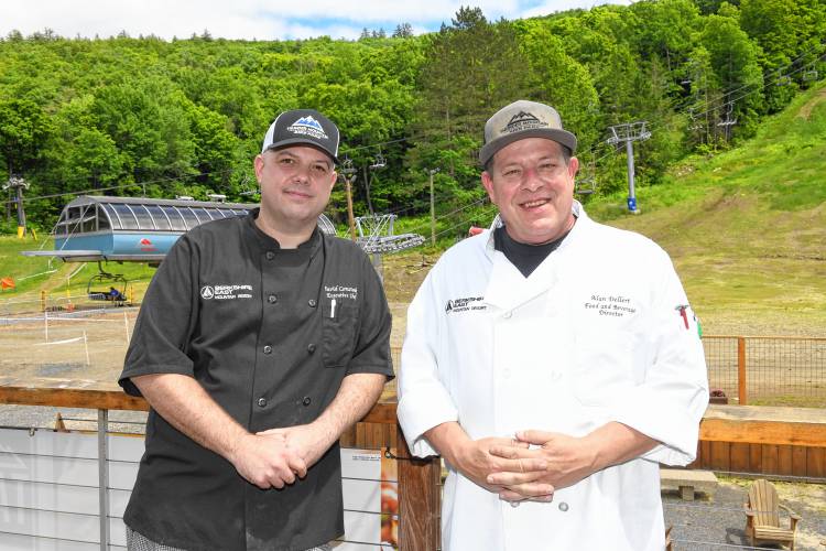 David Comstock, left, executive chef at Berkshire East Mountain Resort, and Alan Dellert, food and beverage director, on the deck at the Crazy Horse Bar and Grill in Charlemont.