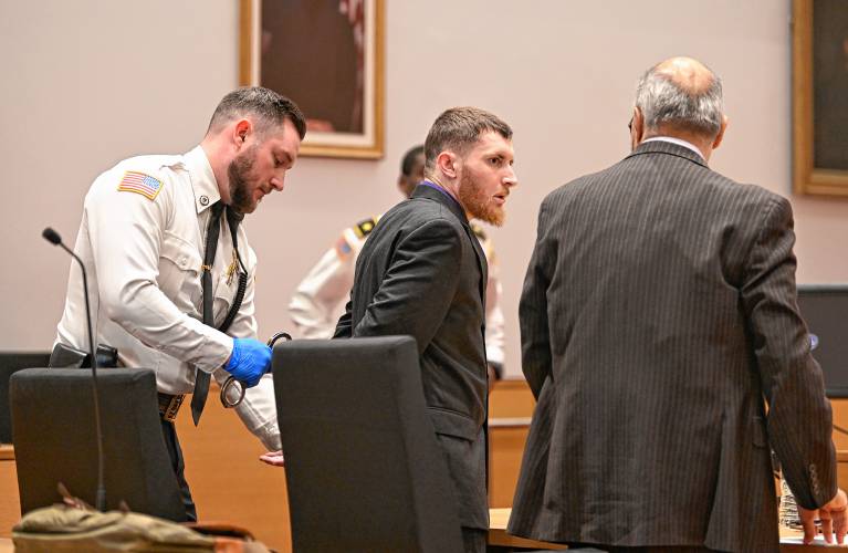 Javery Hattat is handcuffed by a court officer as a guilty verdict is read in Franklin County Superior Court on Wednesday. At right is his attorney R. David DeHerdt.