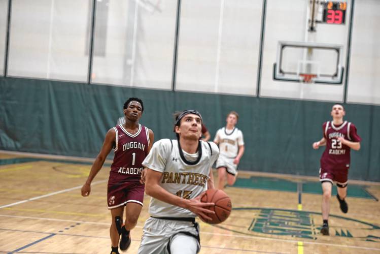 Pioneer's Alex McClelland goes in for the layup on Saturday against Duggan during the Western Mass. Class D championship game at Holyoke Community College. 