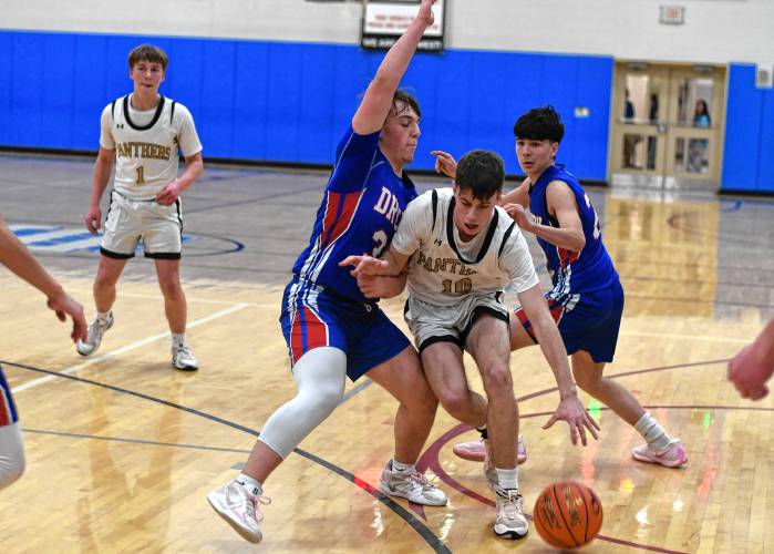 Pioneer’s Brayden Thayer splits two Drury defenders during the Panthers’ 49-23 victory in the MIAA Division 5 semifinals at West Springfield High School Tuesday night.