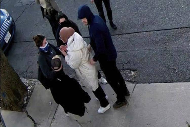 In this image taken from security camera video, Rumeysa Ozturk, a 30-year-old doctoral student at Tufts University, is snatched off a street in Somerville by Department of Homeland Security agents on March 26. In this image taken from security camera video, Rumeysa Ozturk, a 30-year-old doctoral student at Tufts University, is snatched off a street in Somerville by Department of Homeland Security agents on March 26.