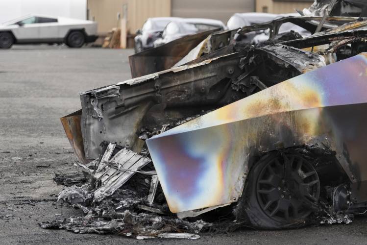 A burned Tesla Cybertruck is parked at a Tesla lot in Seattle, Monday, March 10, 2025. A burned Tesla Cybertruck is parked at a Tesla lot in Seattle, Monday, March 10, 2025.