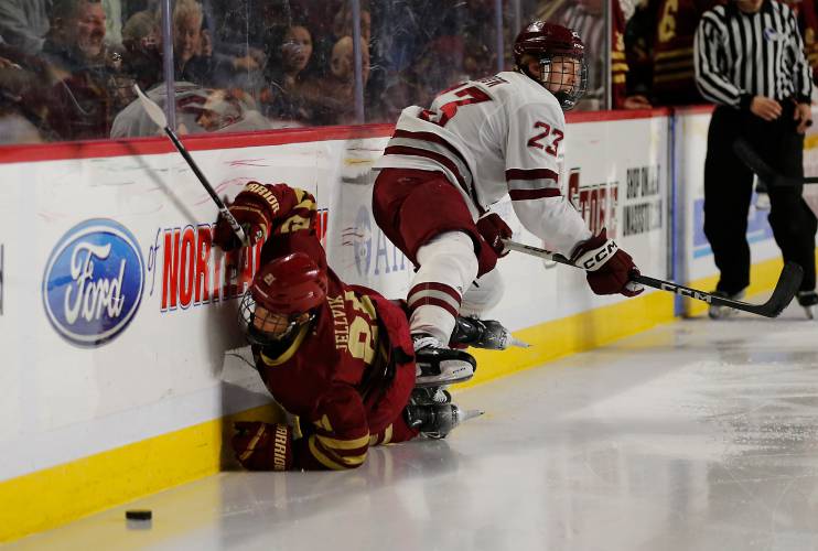 UMass defender Scott Morrow (23) knocks Boston College’s Oskar Jellvik (21) into the boards in the second period earlier this season at the Mullins Center. UMass defender Scott Morrow (23) knocks Boston College’s Oskar Jellvik (21) into the boards in the second period earlier this season at the Mullins Center.