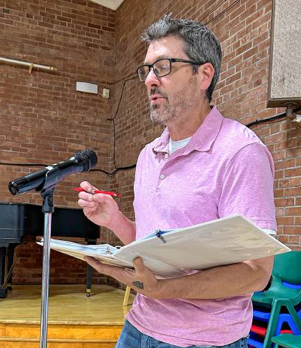 Mohawk Trail Regional School District School Committee member Jason Cusimano explains rising costs for school assessments at Shelburne’s Annual Town Meeting on Tuesday.