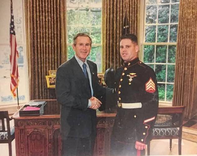 Greenfield resident Michael McIntyre, pictured with former President George W. Bush in the White House while he was serving as Marine One crew chief, has been hired to be Franklin County Technical School’s aviation instructor.
