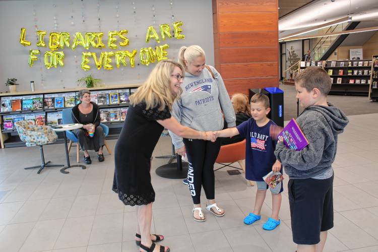 Greenfield Superintendent of Schools Karin Patenaude shakes hands with a student at a meet and greet event held at the Greenfield Public Library earlier this year. Greenfield Superintendent of Schools Karin Patenaude shakes hands with a student at a meet and greet event held at the Greenfield Public Library earlier this year.