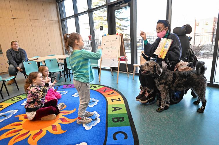 Greenfield resident Mya Pol and her service Labradoodle Winston read books to children in the Children’s Room at the Greenfield Public Library on Thursday. Additional storytimes will be offered on Thursdays, Jan. 16 and Jan. 30, at 10 a.m. as well as on Thursday, Jan. 23, at 3:30 p.m. Greenfield resident Mya Pol and her service Labradoodle Winston read books to children in the Children’s Room at the Greenfield Public Library on Thursday. Additional storytimes will be offered on Thursdays, Jan. 16 and Jan. 30, at 10 a.m. as well as on Thursday, Jan. 23, at 3:30 p.m.