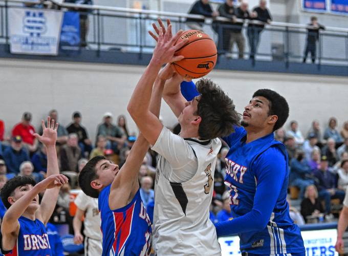 Pioneer’s Kurt Redeker is fouled as he shoots against Drury during the Panthers’ 49-23 victory in the MIAA Division 5 semifinals at West Springfield High School Tuesday night.