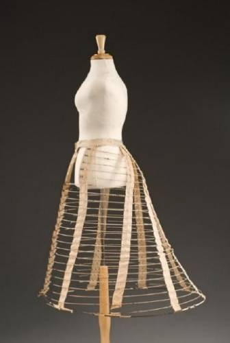 RIGHT: Cage crinoline, Odessa Skirt Company, Gloucester, Mass, about 1867, Cotton tape, steel hoops, Anonymous Gift.
