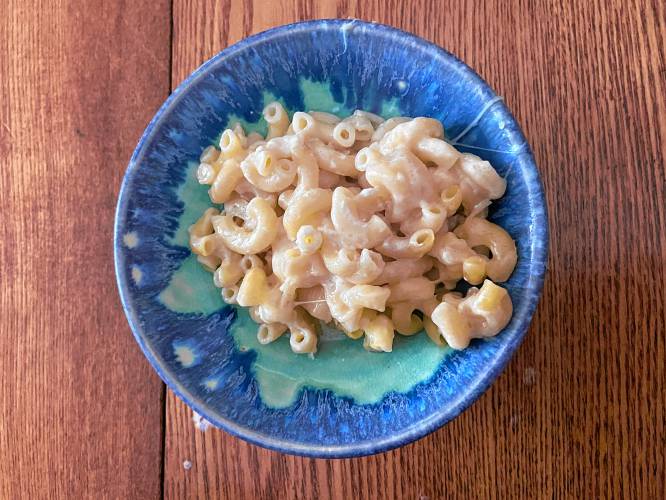 A small portion of Macaroni Pie. The recipe calls for boiling the macaroni in a mixture of milk and water, which gives it additional texture and richness.