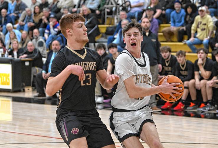 Pioneer’s Brayden Thayer goes up for two against Old Colony’s Nick Fringuelli during the top-seeded Panthers’ victory in the MIAA Division 5 Round of 16 on Tuesday at Messer Gymnasium in Northfield. 