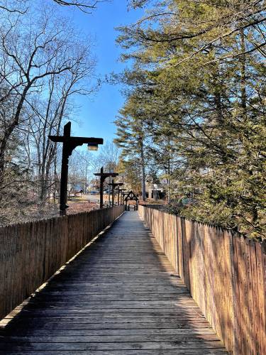 The Bridge of Names, built in 1975 after a storm knocked down the original bridge built in 1888 by Frank Bickford to connect the two halves of Lake Pleasant, “the Highlands” and “the Bluffs.”