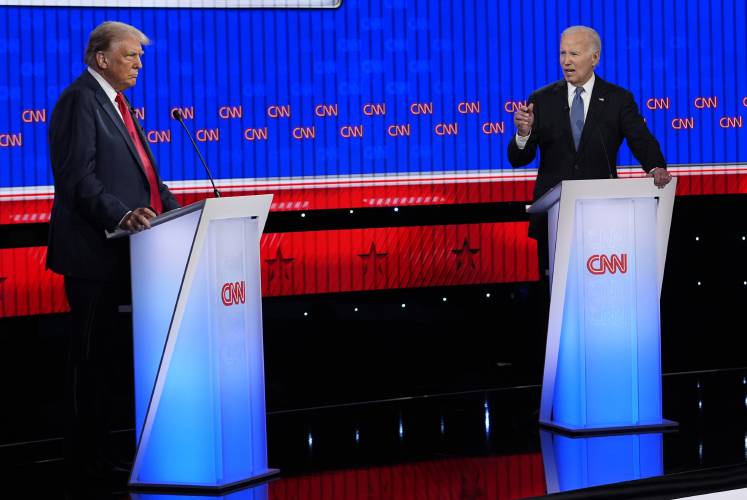 President Joe Biden, right, and Republican presidential candidate former President Donald Trump, left, participate in a presidential debate hosted by CNN, Thursday, June 27, 2024, in Atlanta.