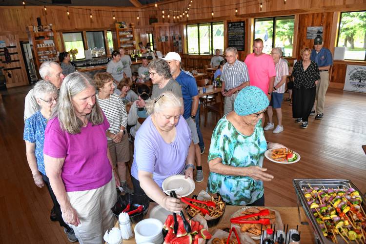 Northfield Council on Aging volunteers enjoy lunch at The Brewery at Four Star Farms in Northfield on Thursday after a boat ride on the Connecticut River.