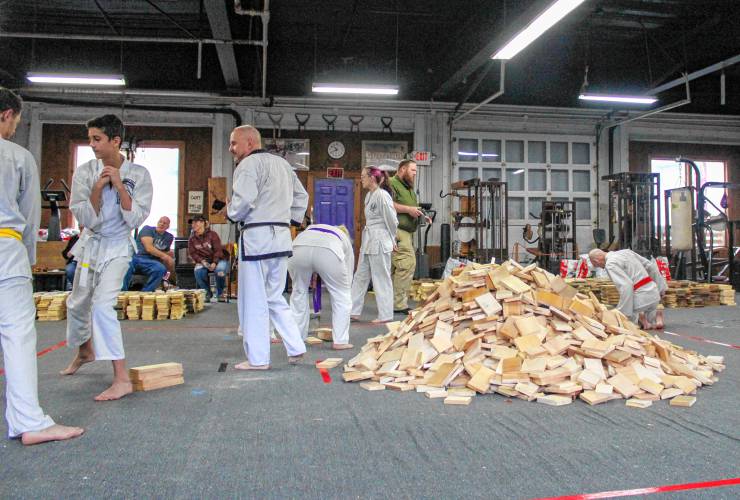 The 22nd annual “Break-athon” to raise money for the Greenfield Recorder’s Warm the Children charity was held at the Greenfield Tae Kwon Do Center on Nov. 23. The pile of broken boards in the center of the room grew as the day progressed. Each broken board represents a pledged dollar amount to the charity, and the boards are then sold as kindling to raise even more money. The 22nd annual “Break-athon” to raise money for the Greenfield Recorder’s Warm the Children charity was held at the Greenfield Tae Kwon Do Center on Nov. 23. The pile of broken boards in the center of the room grew as the day progressed. Each broken board represents a pledged dollar amount to the charity, and the boards are then sold as kindling to raise even more money.