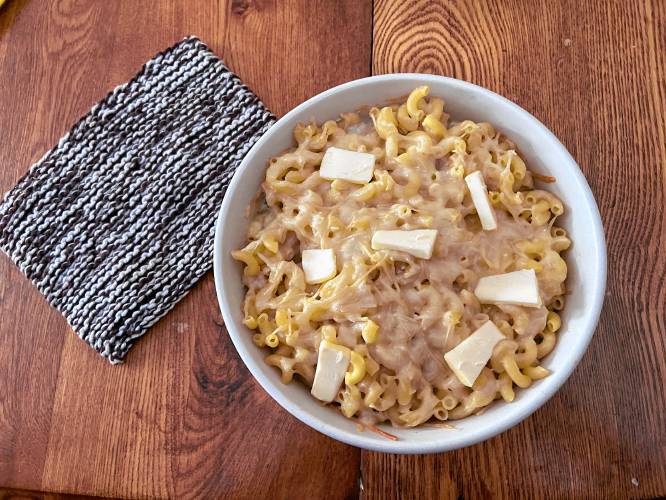 More butter added to the Macaroni Pie. The recipe includes half a stick of butter in the macaroni itself, plus a tablespoon or two added later, sliced.