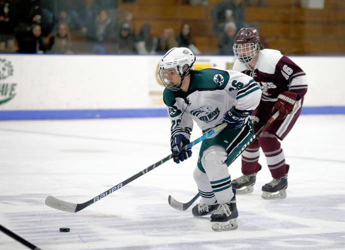Greenfield’s Evan Galli (26) carries the puck against Easthampton in the second period Saturday night at Collins-Moylan Arena in Greenfield.