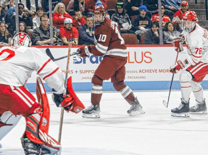 UMass’ Dans Locmelis (10) puts a shot on net during the Minutemen’s 3-2 overtime loss to Boston University in the Hockey East quarterfinal round Saturday at Agganis Arena in Boston. UMass’ Dans Locmelis (10) puts a shot on net during the Minutemen’s 3-2 overtime loss to Boston University in the Hockey East quarterfinal round Saturday at Agganis Arena in Boston.
