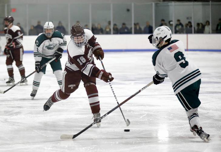 Easthampton’s Rob Herman (16) fires a shot against Greenfield in the second period Saturday night at Collins-Moylan Arena in Greenfield.
