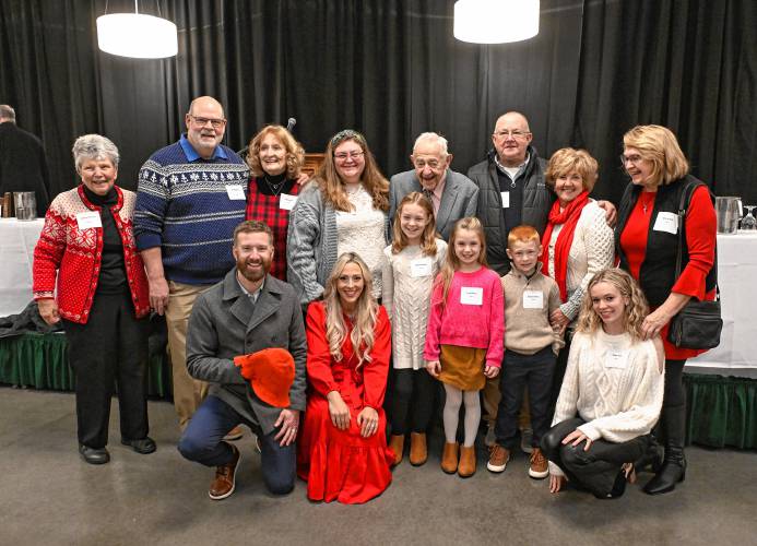 Greenfield Recorder Citizen of the Year Russell Deane of Bernardston, center, poses for a photo with family members on Friday morning at the Franklin County Chamber of Commerce breakfast at Deerfield Academy.
