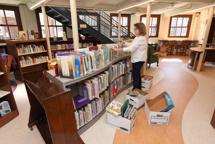 Arms Library Director Laurie Wheeler in the children’s section on the library’s lower level. Arms Library Director Laurie Wheeler in the children’s section on the library’s lower level.