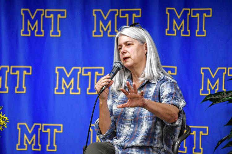 Author Lydia Millet speaks to students in the Mohawk Trail Regional School library on Tuesday.