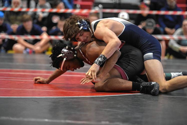 Franklin Tech's Landon Purington tries to establish position against Duggan's Bryce Hall in the 132 championship match during the MIAA Div. 3 West Championship at Mount Greylock High School Saturday. 