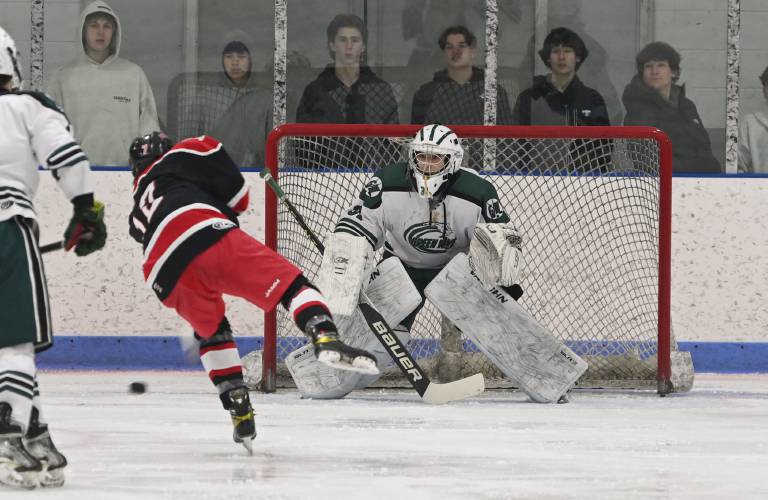 Greenfield goalie Cooper Smith makes a save off a shot from Westfield’s Sean McMahon at Collins Moylan Ice Arena in Greenfield earlier this season. Greenfield goalie Cooper Smith makes a save off a shot from Westfield’s Sean McMahon at Collins Moylan Ice Arena in Greenfield earlier this season.