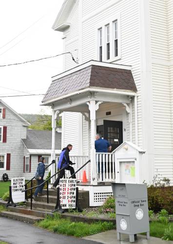 Residents head inside Bernardston Town Hall to vote on Monday.