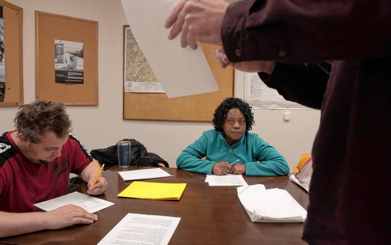 Thane Thomsen, an instructor with The Literacy Project, at right, teaches a high school equivalency test class in Easthampton to students Peter Morris and Sharon Beeson-Nelson. The Literacy Project has expanded to Easthampton, its sixth location in the Pioneer Valley.