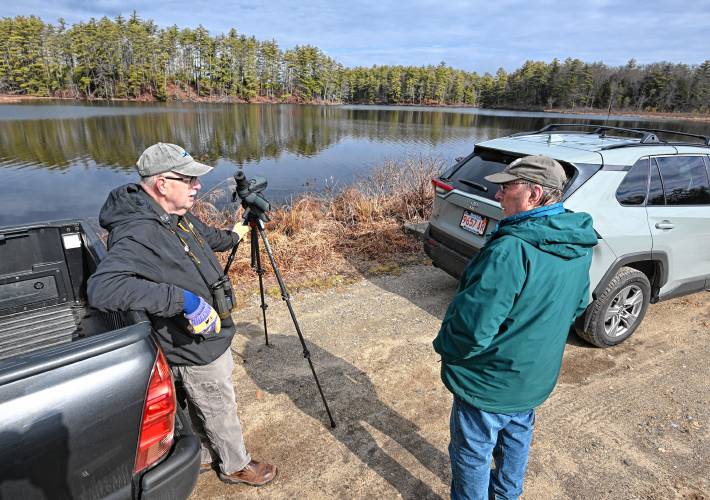 Athol resident Jeff Johnstone and New Salem resident Dale Monette chat while bird watching at Lake Rohunta on Tuesday.