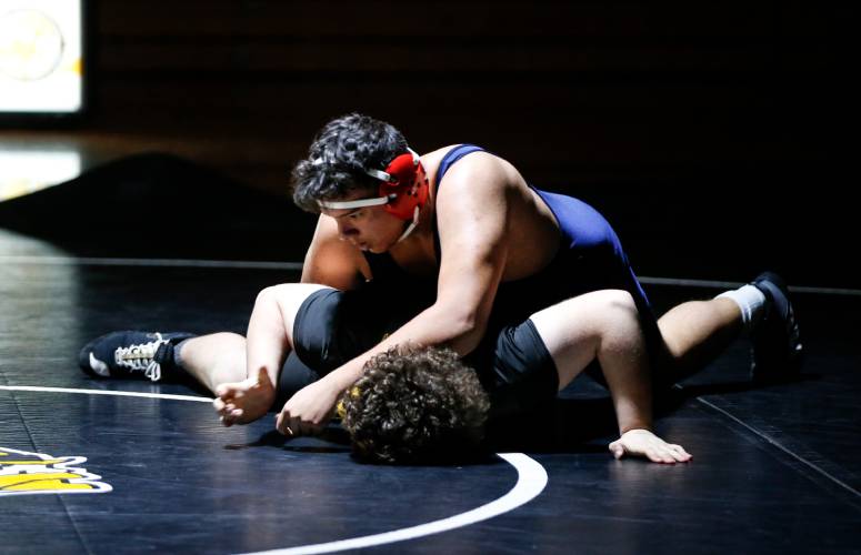Frontier’s Javion Cabrera, top, competes against Smith Vocational’s Colin Pascal in the 285-pound weight class last week in Northampton. Frontier’s Javion Cabrera, top, competes against Smith Vocational’s Colin Pascal in the 285-pound weight class last week in Northampton.